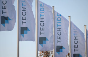 Banner mit dem Logo der Techtide vor dem Eingang der Messe.