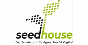 Logo des Seedhouse in Grün und Schwarz mit stilisiertem Pflanzensetzling.